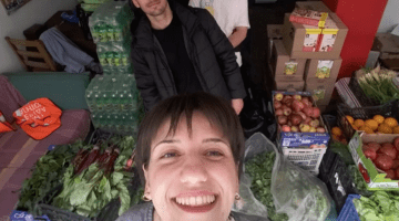 Prevolarides activists take a picture with the vegetables and fruits collected