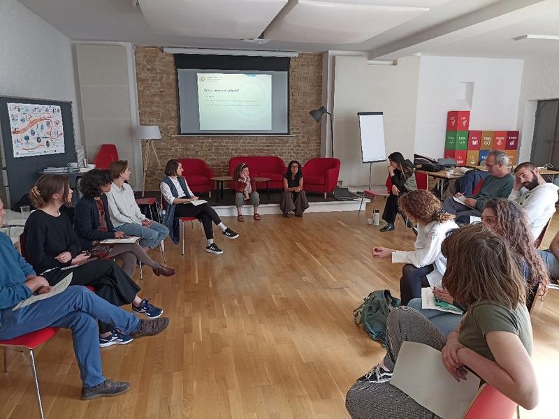 A group of people at a workshop discussing values 