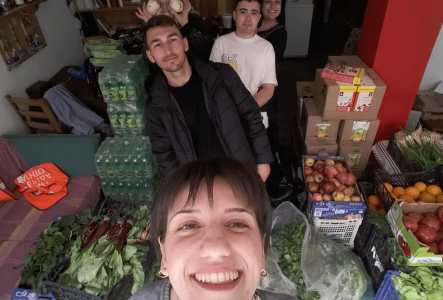 Prevolarides activists take a picture with the vegetables and fruits collected 