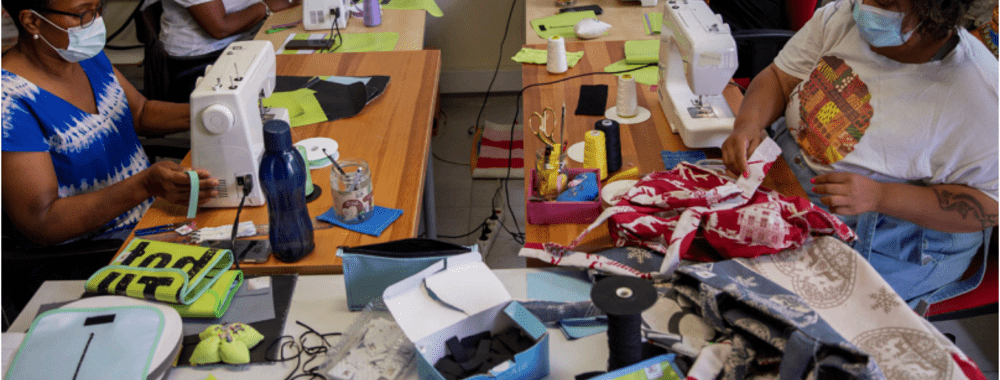 Picture of Cascai project - several women working with garment