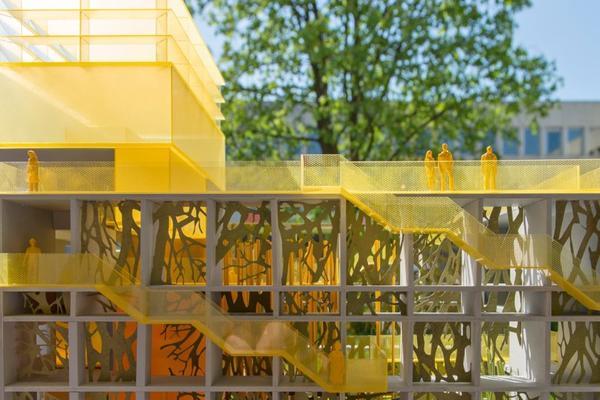 Building façade with intriguing permeable, yellow exterior